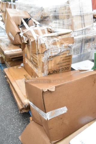 Three boxed items on a pallet, including Regency stainless steel utility cart and Lancaster butcher block table, with visible damage.