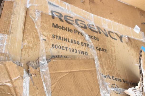 Damaged cardboard box for 600CT1931WD Regency stainless steel cart, showing packaging tears and markings.