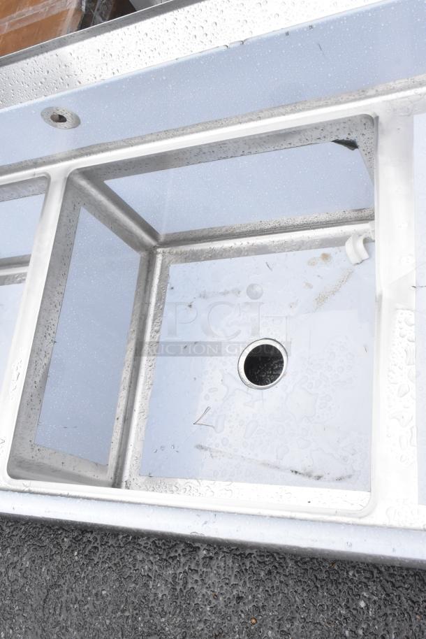 Regency 600S42424224 stainless steel 4 bay sink with dual drain boards, brand new with scratches, no legs included.