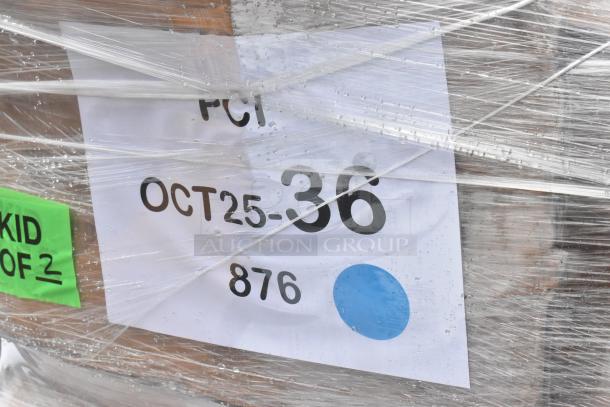 Shrink-wrapped pallet with tags reading "OCT25-36" and "SKID OF 2," containing brand new Sani-Lav sinks.
