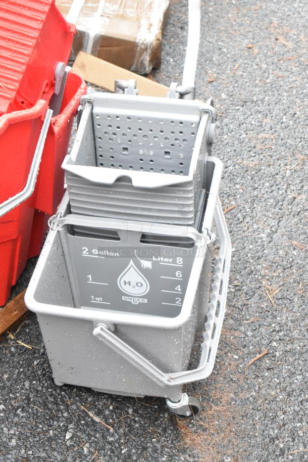 Brand new poly mop bucket, gray with a wringer. Capacity: 2 gallons. Unger logo visible. Scratch and dent condition.