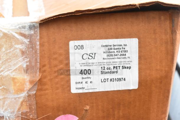 Cardboard box with label "CSI, 12 oz. PET Skep Standard, Lot #310974, Quantity 400." Packaging partially sealed with tape.