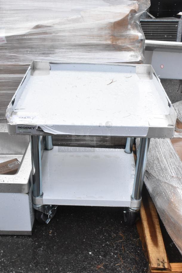 BRAND NEW SCRATCH AND DENT Regency 600ES2424GK 24"x24" stainless steel equipment stand with galvanized undershelf and casters.