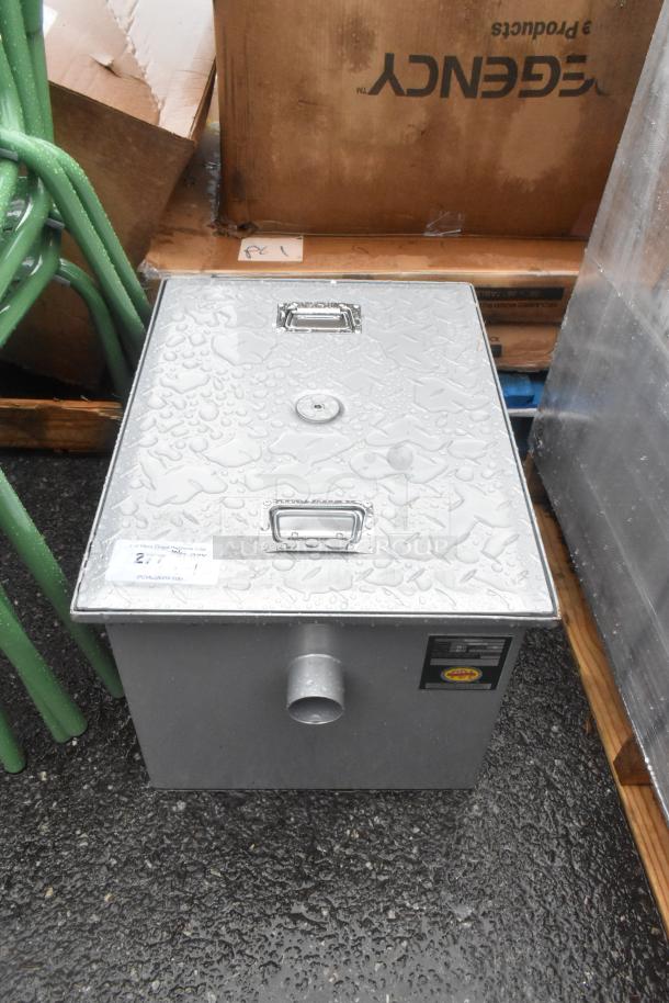 BRAND NEW Regency 600GT15 grease trap, 30 lb., 15 GPM, with 2" non-threaded connections, visible dents, auction label.
