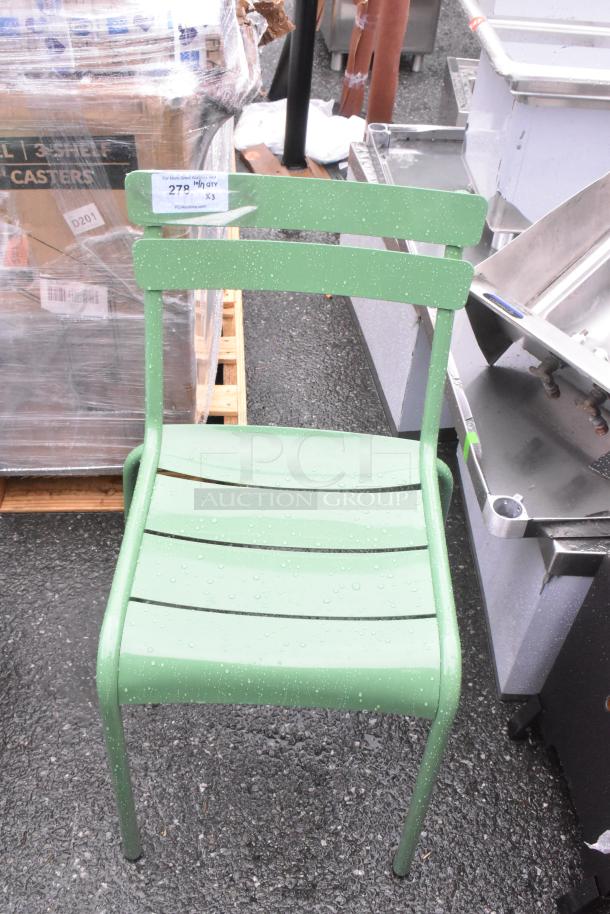 Brand new green patio chair, scratch and dent condition. Durable metal frame with slatted design. Auction tag: "279" and "Qty X3".