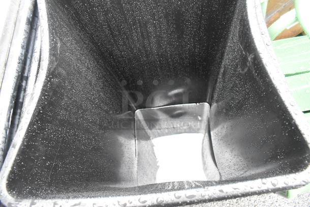 Black poly trash bin, new with minor scratches. 2 available. Durable construction, ideal for outdoor use.