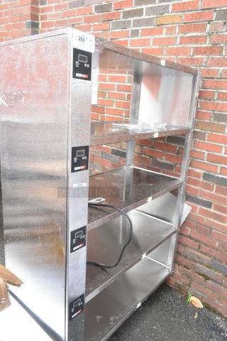 Brand new ServIt stainless steel 4-tier warming display case, 115V, 1 phase, with minor scratches and dents.