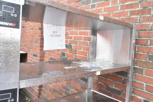 ServIt stainless steel 4-tier warming display case, brand new scratch and dent, 115V, 1 Phase, PCI auction label visible.