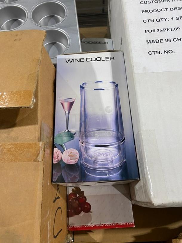 Mixed pallet of brand new commercial kitchenware, featuring a boxed Stolzle wine cooler. Boxes show models and contents.