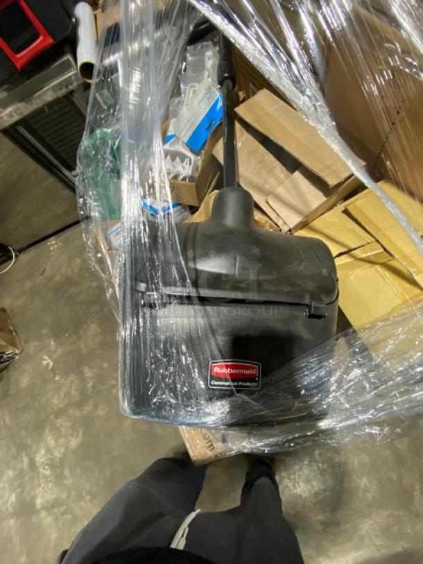 Brand new Rubbermaid Untouchable beige swing top trash lid, Model 2689-88, wrapped on a pallet, visible label and packaging.