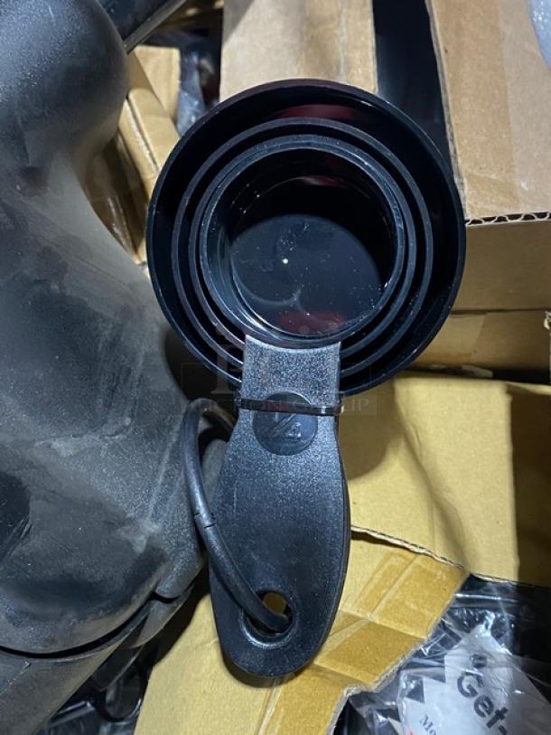 Mixed pallet with Rubbermaid Untouchable swing top lid, WaveBrake mop bucket, and Adcraft utensils, in packaging.
