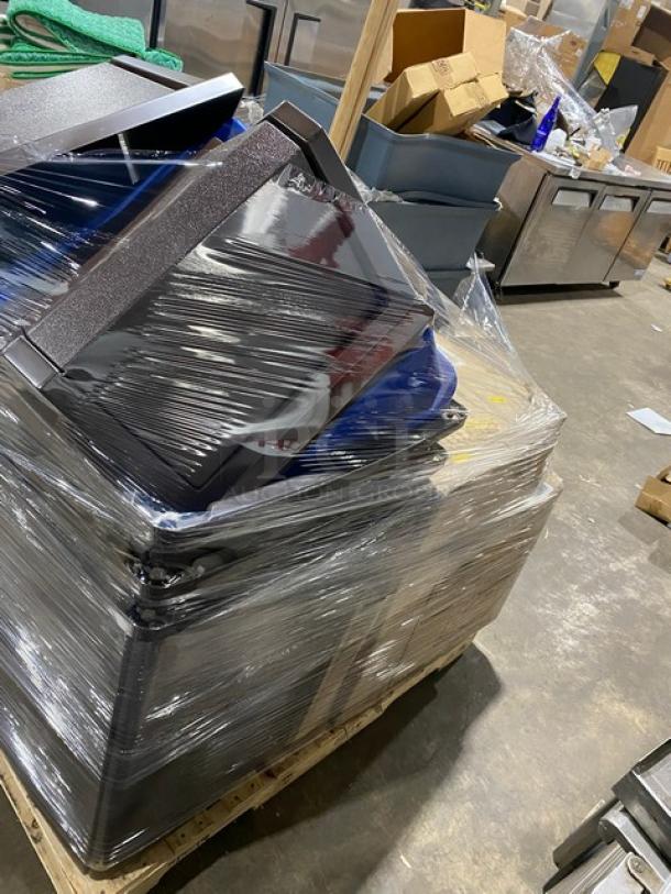 Stack of new commercial items including Rubbermaid trash cans, lids, and accessories, wrapped in plastic on a pallet.
