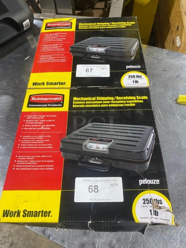 Brand new Rubbermaid Pelouze FGP250S mechanical shipping scale, 250 lb capacity, black, briefcase-style, on legs, boxed.