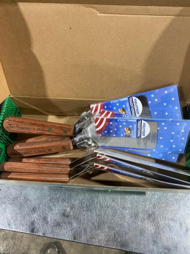 Dexter Russell S242 stainless steel turners in box, new condition, 4"x2" blades, wooden grip handles, branded packaging.