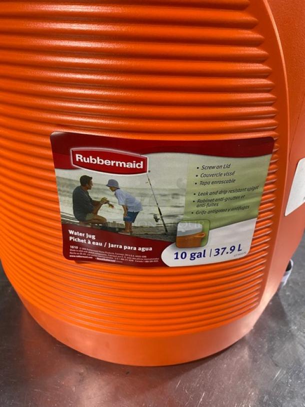 Rubbermaid Commercial 10 Gal. orange insulated water jug, model 1610, with white screw-on lid and thumb-trigger spigot.