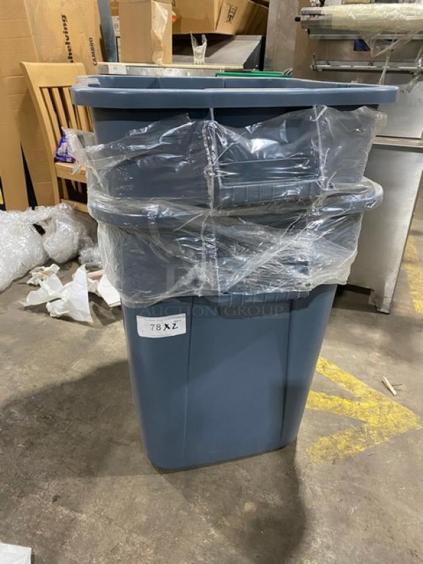 Brand new Rubbermaid Commercial gray square trash can with handles, wrapped in plastic, showing label "78X2".