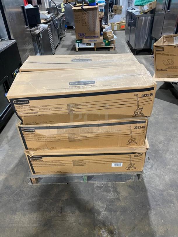 Rubbermaid FG253300BLA lobby dustpan boxes on pallet. Brand new, commercial black upright model, 6 per case.