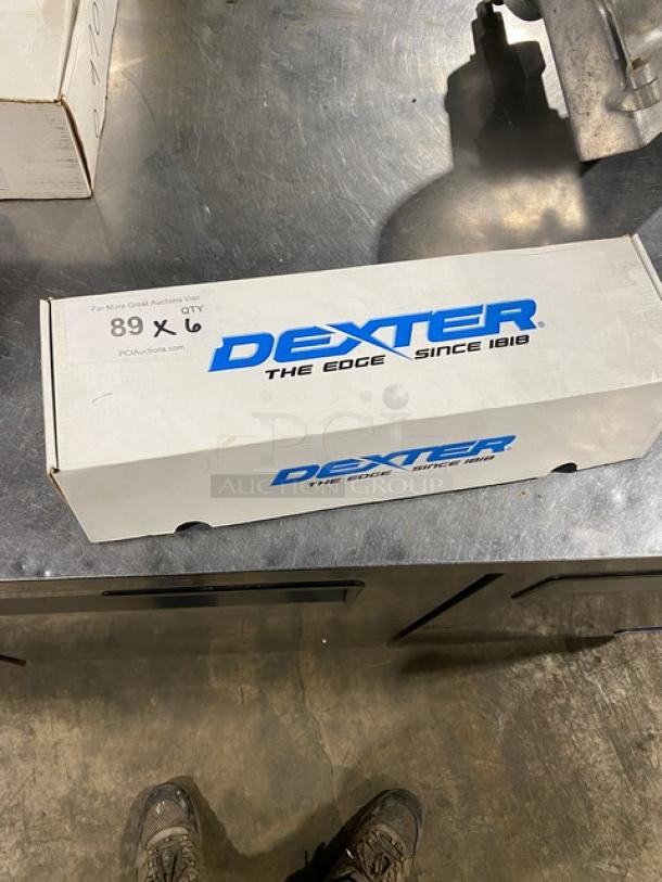 Brand new Dexter Russell SofGrip 10" Cook's Knife, model SG145-10, in original box. White grip handle, stainless steel blade.