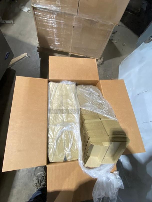 Brand new Sabert 55320 clamshell take-out containers on a pallet. Kraft fluted, vented, 420 per case.