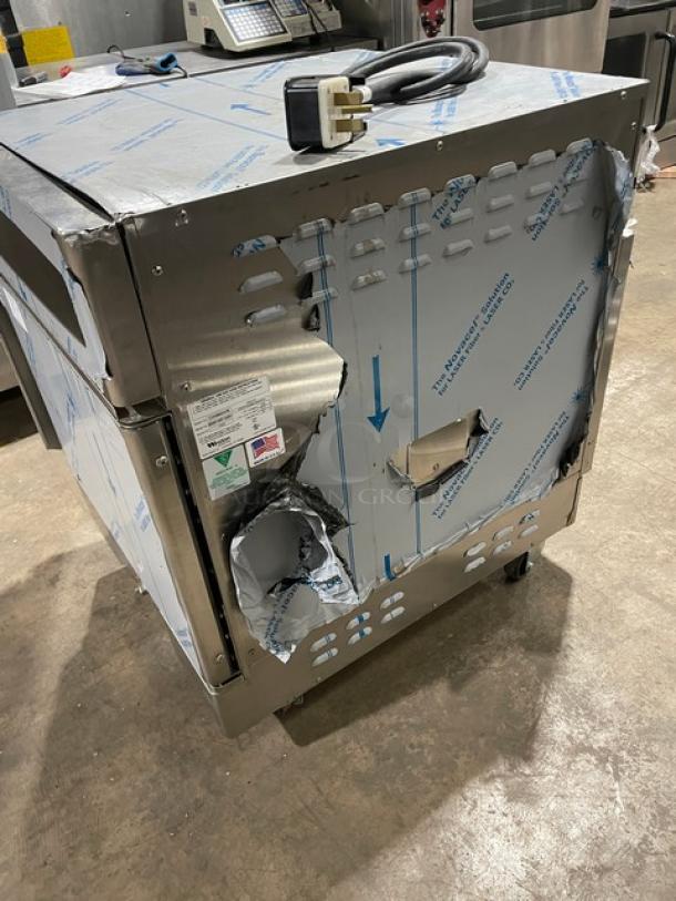 Winston CVap Series CHV504UVR Cook & Hold Oven, stainless steel, visible dents, on casters, 208V 1 Phase, power cord shown.