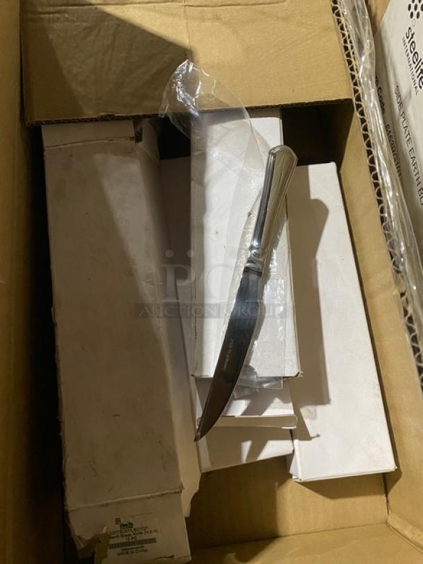 Mixed pallet with Novacart mini loaf molds, SQP food trays, Steelite porcelain plates, Cambro deli crock, and Camtray market tray.