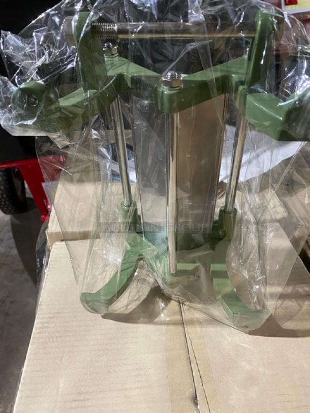 Brand new Winco FFC-375 French-fry cutter, cast iron, 3/8" cut, on legs, wrapped in plastic packaging, unused.