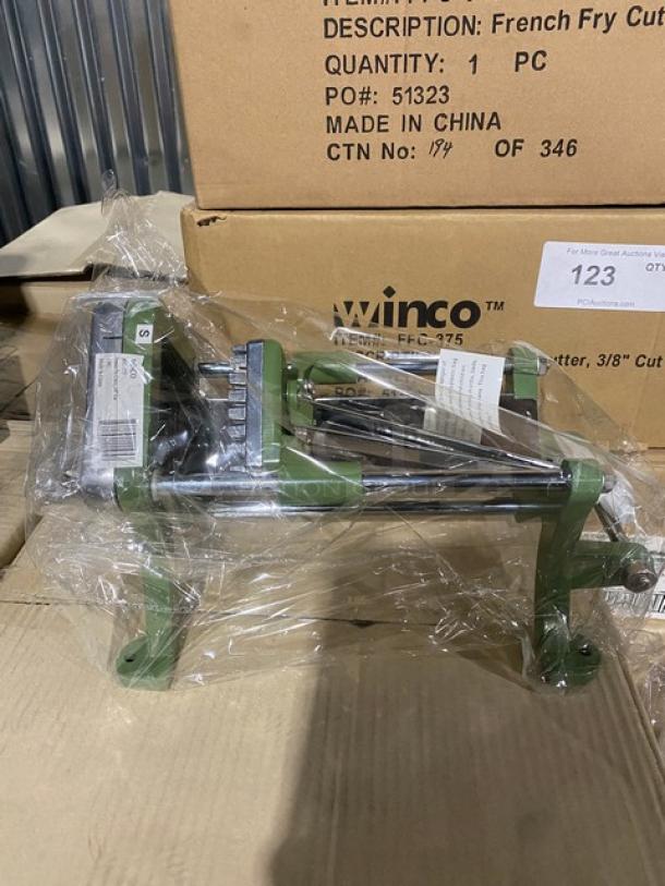 Brand new Winco FFC375 cast iron French-fry cutter, 3/8" cut, on legs, wrapped in plastic, includes box details.