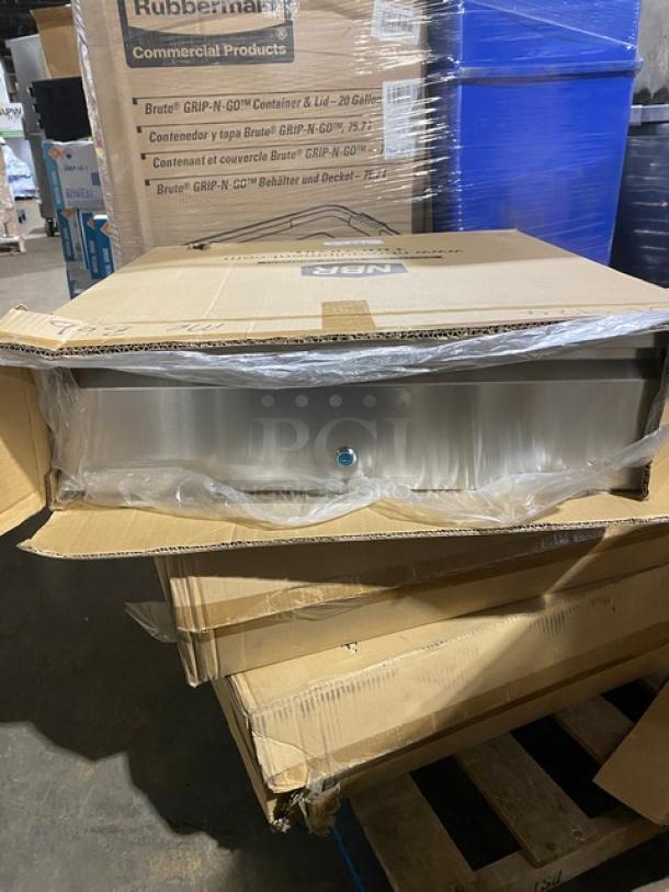Brand new NBR TDR2020L stainless steel self-closing drawer assembly with lock in packaging.