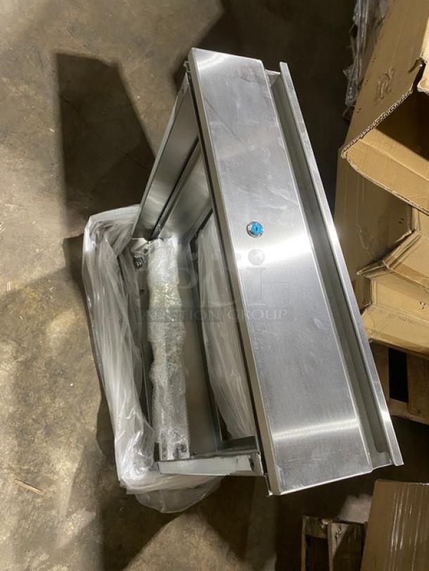 Brand new NBR stainless steel self-closing drawer assembly, model TDR2020L, with lock, in pristine condition.
