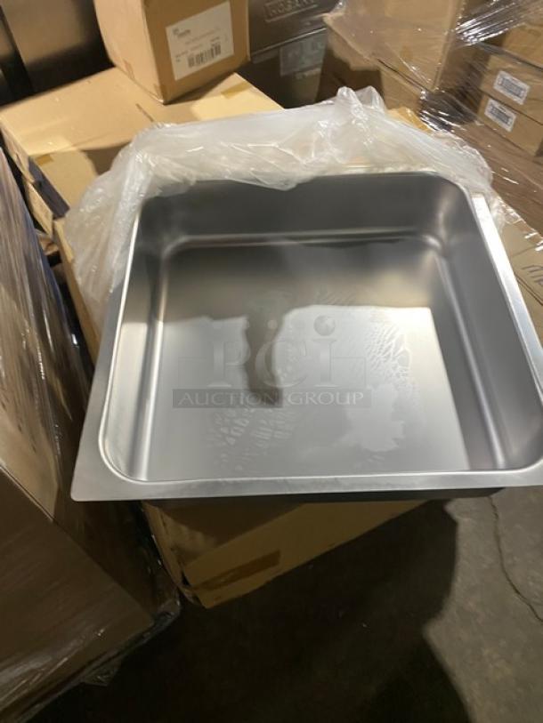 Brand new NBR TDR2020L stainless steel self-closing drawer assembly with lock, unpackaged on a warehouse floor.