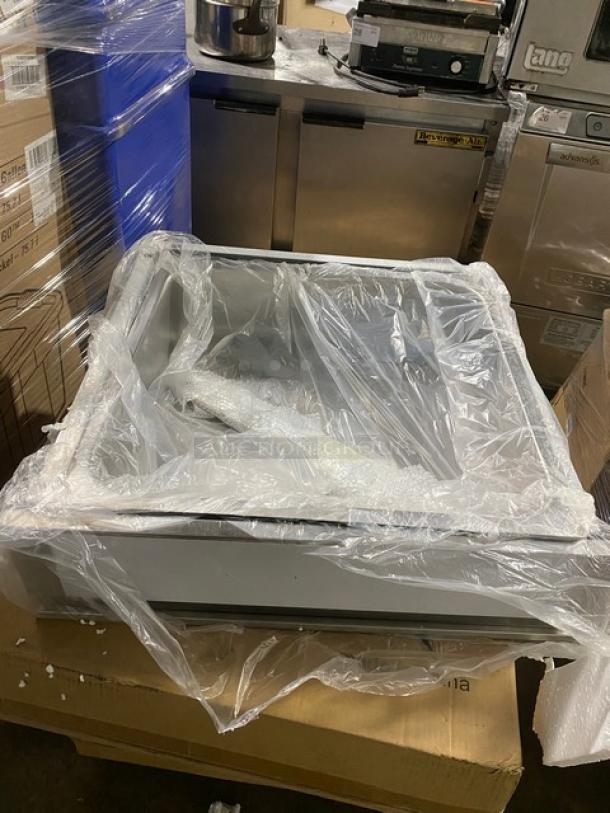 Brand new NBR TDR-2020 stainless steel drawer assembly, wrapped in protective plastic, pristine condition.