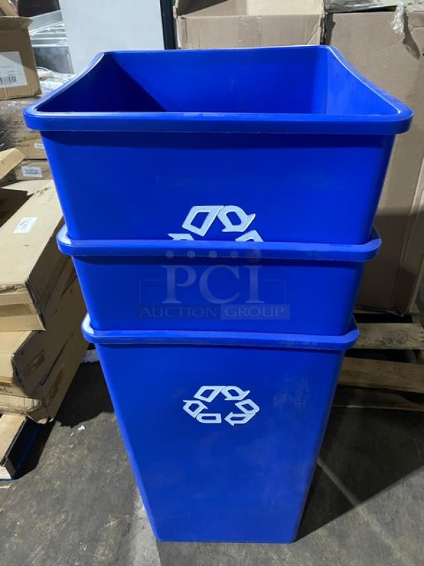 Rubbermaid Commercial blue square 50 gal. Untouchable recycling bin, new. Features recycling symbol, stackable design.