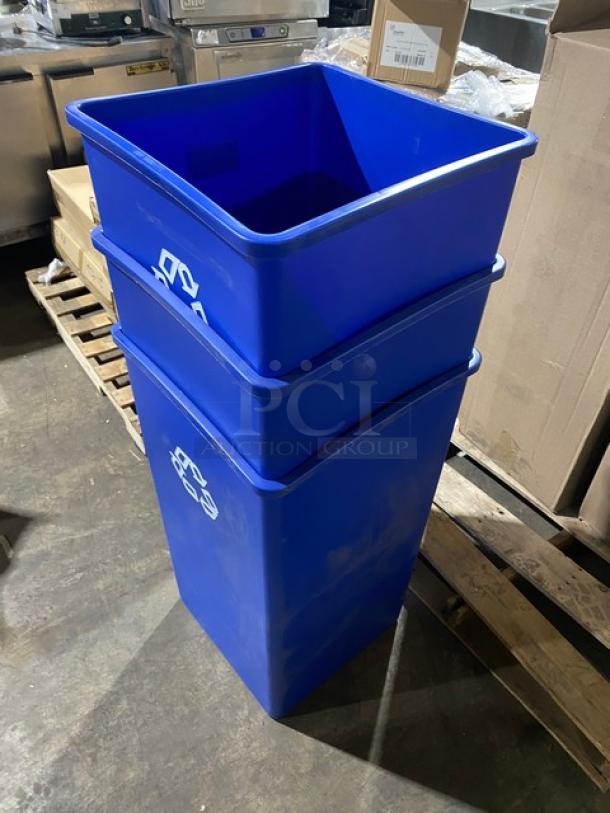 Brand new Rubbermaid Commercial blue 50-gal. recycling container; square design, stackable, labeled with recycling symbol.