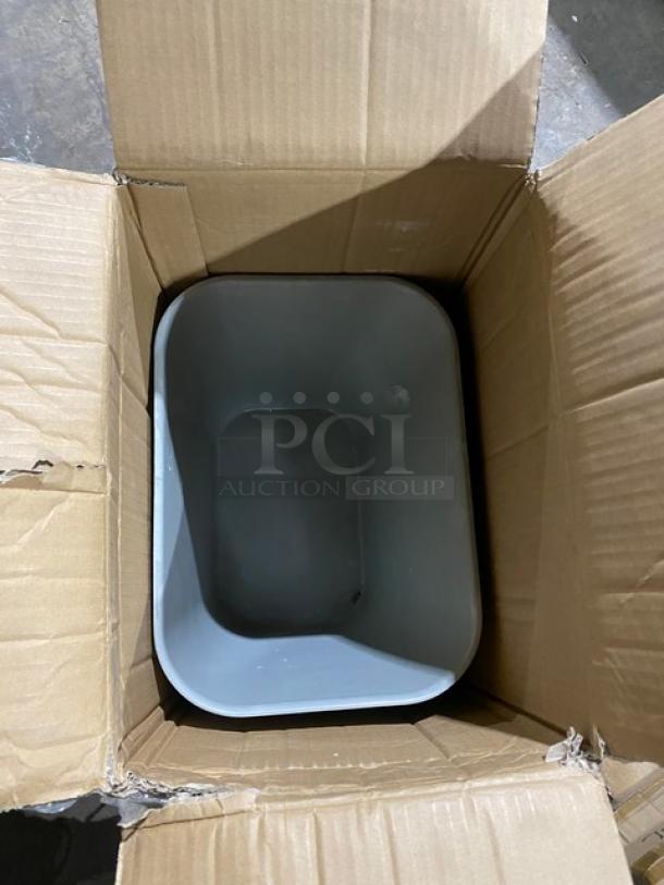 Brand new Rubbermaid 28 Qt. gray fire-resistant rectangular wastebasket, model 2543, in open box.