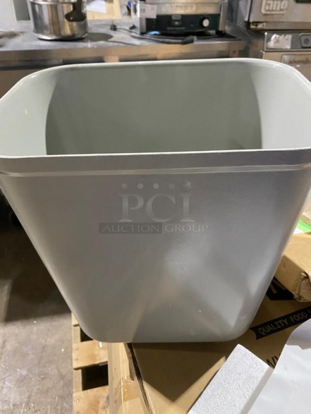 Brand new Rubbermaid Commercial gray 28 Qt. fire-resistant wastebasket, model 2543, in pristine condition.
