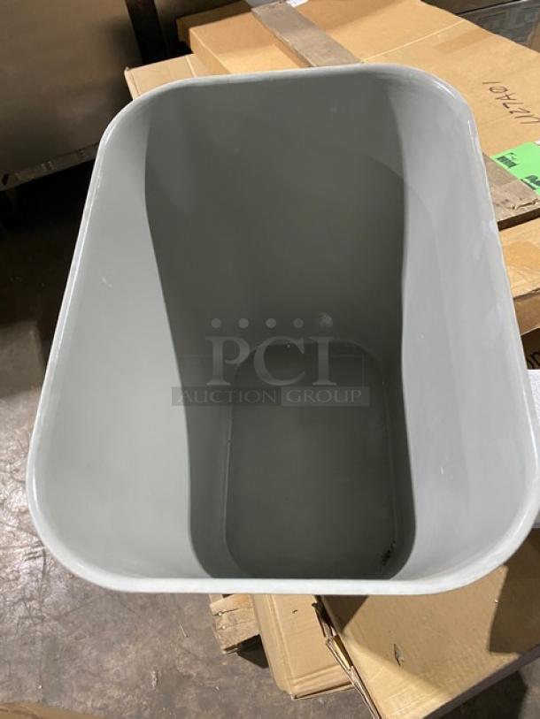 Brand new Rubbermaid 28 Qt. gray rectangular fire-resistant wastebasket, model 2543, in pristine condition.