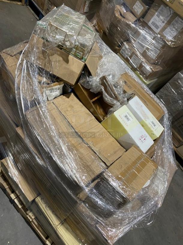 Mixed pallet of new commercial serveware items wrapped in plastic, including beverage glasses, china plates, mugs, deli bags, bowls, and more.