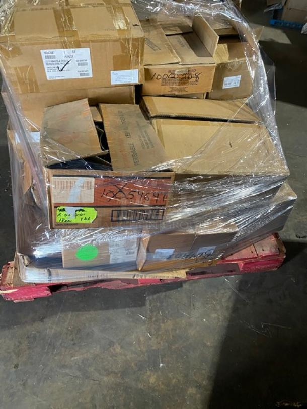 Mixed pallet of brand-new commercial kitchen items, shrink-wrapped. Includes Steelite carafe lid, Tuxton plate, Chef Specialties pepper mill, Carlisle sandwich plate, Steelite pitcher, and teacup. Various models and brands visible on labels.