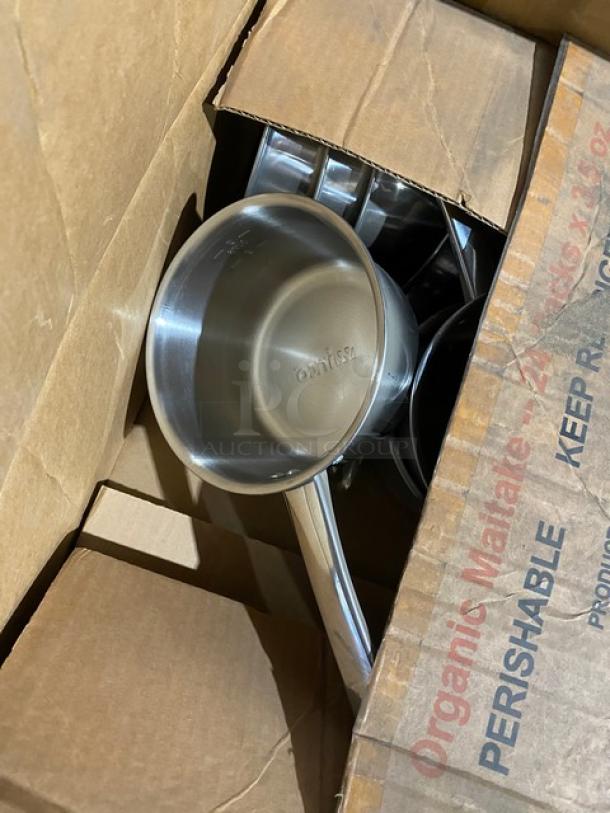 Mixed pallet of new commercial kitchen items in box. Includes Steelite carafe lid, Tuxton plate, Chef Specialties pepper mill, and more.