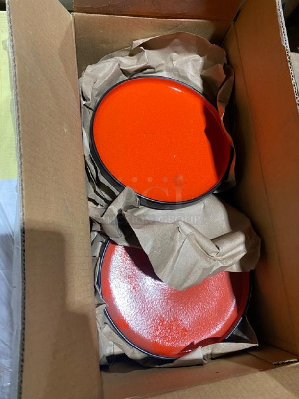 Boxed mixed pallet with new red plates, wrapped in paper. Includes Steelite, Carlisle, Cambro items. Models vary.