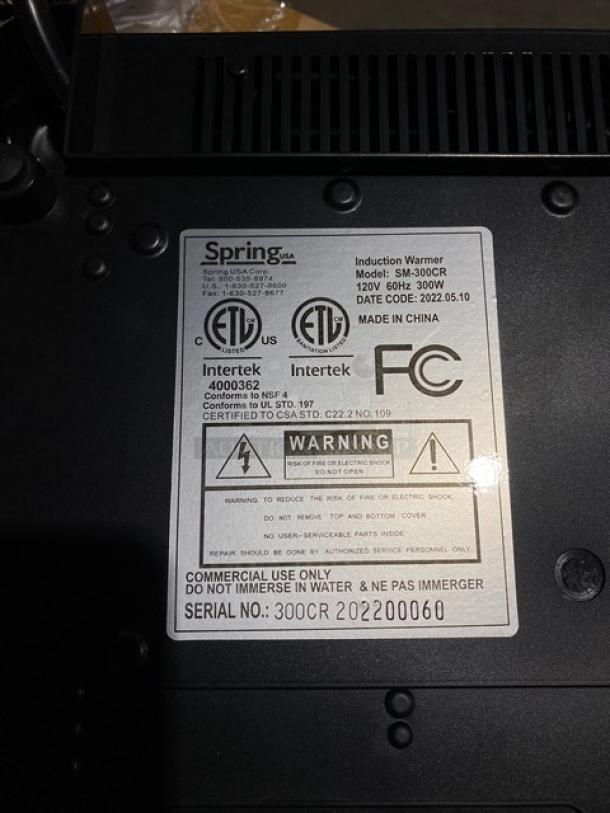 Brand new Spring USA SM-300CR induction warmer, black, single burner, 120V, 300W, model details on label, commercial use.
