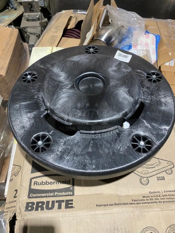 Brand new Rubbermaid BRUTE series black trash can dolly, model FG264000BLA, on casters, labeled box shown.