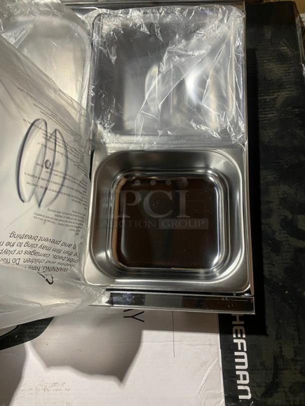 Brand new Chefman RJ22-SS-B countertop buffet server and warming tray. Stainless steel pans, 120V, in original packaging.