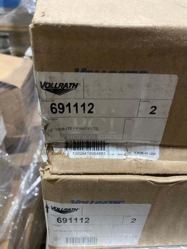 Brand new Vollrath Tribute Series 12" tri-ply stainless steel fry pan, model 691112, with plated handle. Box label visible.