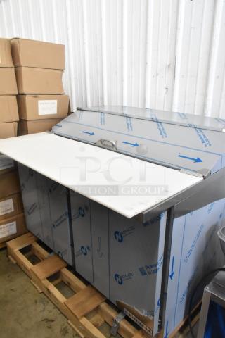 Brand new Beverage Air SPE48HC-12C refrigerated sandwich prep table with 17" cutting board, 48" wide, in original packaging.