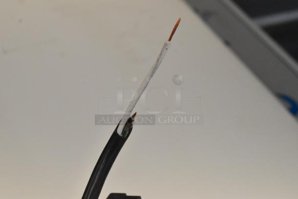 A damaged electrical cord with exposed copper wires on a Beverage Air SPE48HC-12C refrigerator.