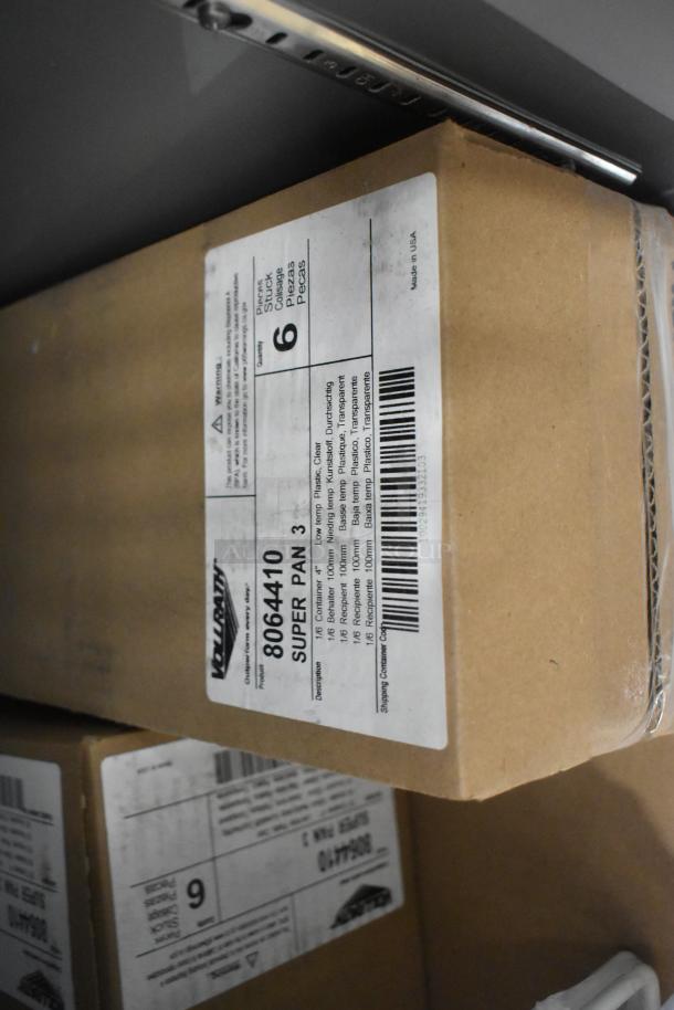 Cardboard box with label indicating "SUPER PAN 3" by Vollrath, containing 6 pieces of clear, low-temp plastic pans. Made in USA.