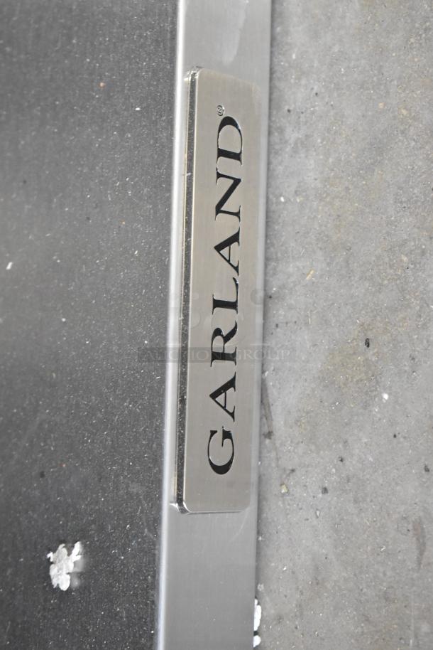 BRAND NEW 2025 Garland C36-NRS stainless steel charbroiler grill, natural gas, with under shelf; minor scratches noted.