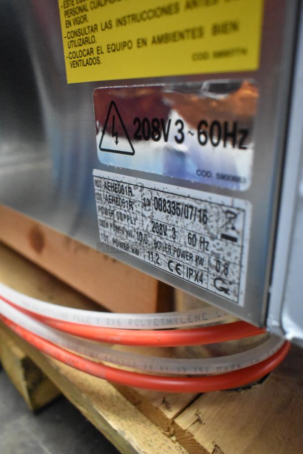 Bakers Pride AEHE061R stainless steel electric combi convection oven, 208V 3-phase. Brand new with minor scratches.