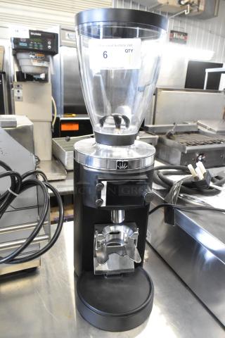 Brand new Mahlkonig E65W GBS black espresso grinder. Scratch and dent condition. Grind-by-Sync technology, 2.6 lb. capacity.